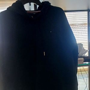 Women pull on sweater